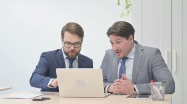 Happy Businessmen Celebrating Success and  Shaking Hand