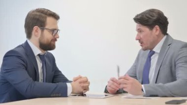 Businessman Talking with Customer at Work