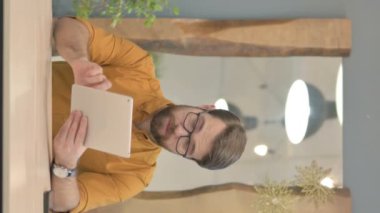 Middle Aged Businessman Cheering Win on Digital Tablet, Vertical Video