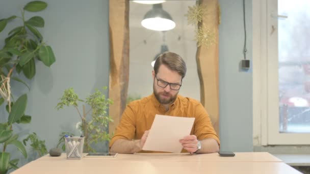 Middle Aged Businessman Feeling Upset Reading Documents Paperwork — стоковое видео