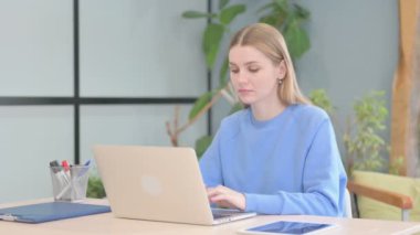 Young Woman Leaving Office after Work