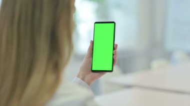 Woman using Smartphone with Green Screen Chroma Key