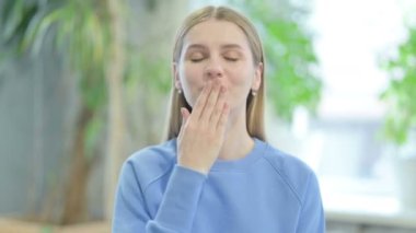 Young Woman showing Heart Shape by Hands