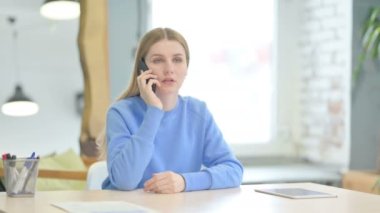 Angry Young Woman Shouting at Work in Frustration