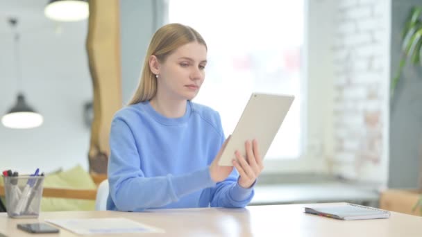Young Woman Using Tablet Browsing Internet — Vídeos de Stock