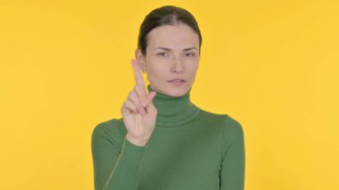 Denying Young Woman Rejecting Idea on Yellow Background