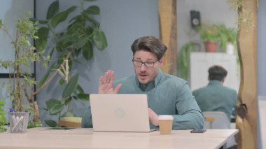 Online Video Chat on Tablet by Middle Aged Businessman