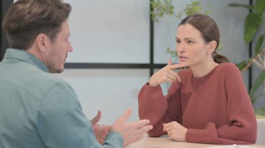 Talking Young People Discussing Work in Office