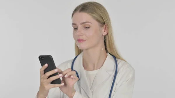 Young Female Doctor Browsing Smartphone White Background — Stockfoto