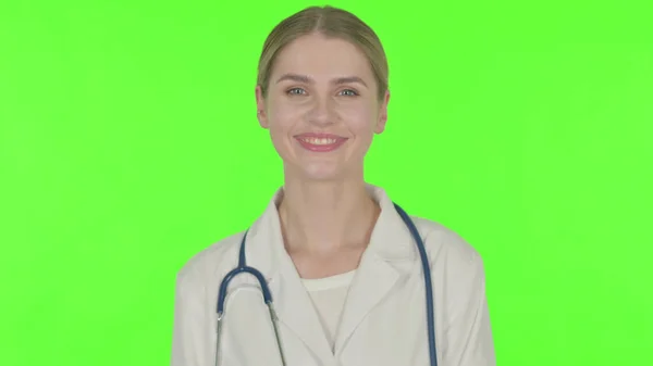 Smiling Young Female Doctor Green Background — Stockfoto
