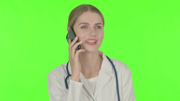 Young Female Doctor Talking Phone Green Background — Stockfoto