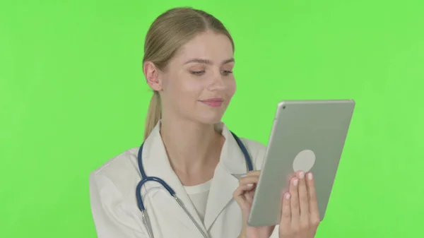 Young Female Doctor Using Digital Tablet Green Background — Stockfoto