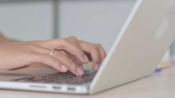 Close Up of African American Woman Typing on Laptop