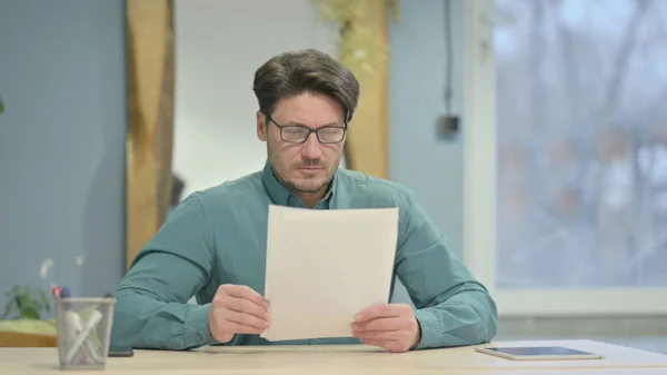 Mature Adult Businessman Reading Documents Office Paperwork — Stockfoto