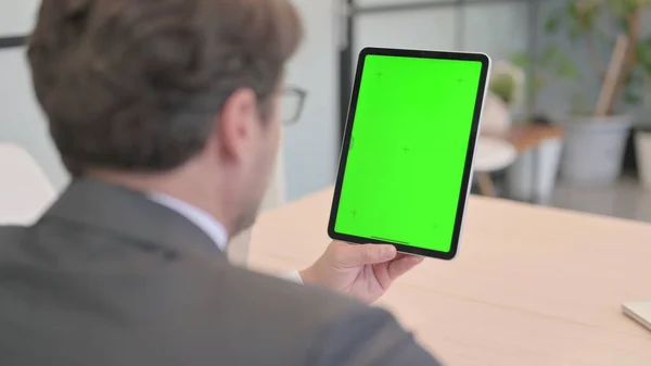 Businessman Using Digital Tablet with Green Screen