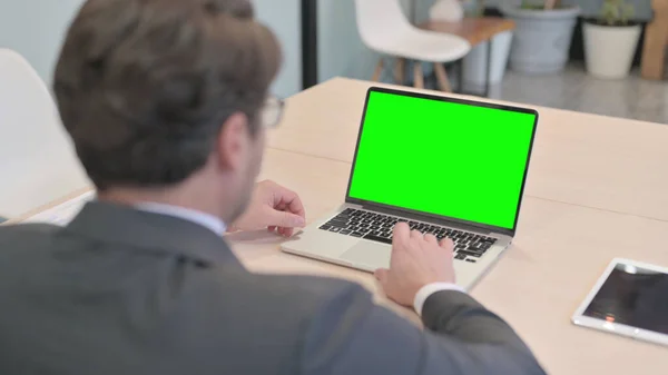 Businessman Working on Laptop with Green Screen, Chroma key