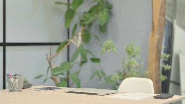 Empty Office after Closed Laptop on Table