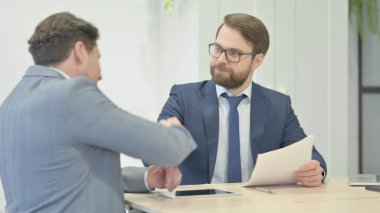 Talking Businessmen During Meeting Shaking Hand, Deal