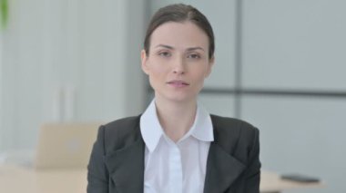 Portrait of Inviting Businesswoman in Office