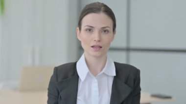 Portrait of Businesswoman showing Ok Sign