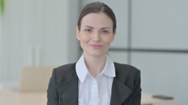 Businesswoman Waving Hand to Say Hello