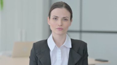 Portrait of Businesswoman in Denial with Stop Gesture