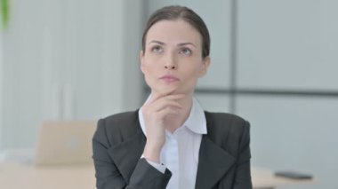 Portrait of Brainstorming Businesswoman Thinking New Plan