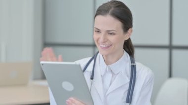 Online Video Chat by Young Doctor on Tablet