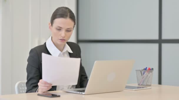Businesswoman Celebrating Success While Doing Paperwork — Stock Video