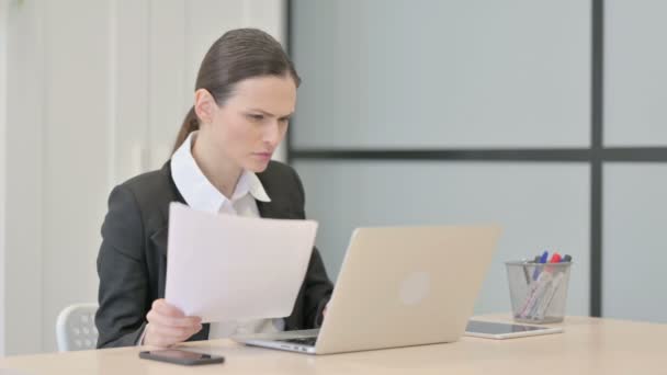 Businesswoman Feeling Upset While Doing Paperwork — Vídeos de Stock