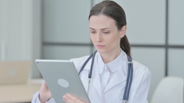 Portrait Young Doctor Browsing Tablet — Stockvideo