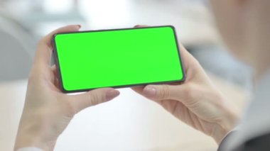 Close up of Woman Watching Smartphone with Green Screen