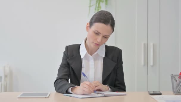 Stressed Young Businesswoman Trying Write Work — Stockvideo