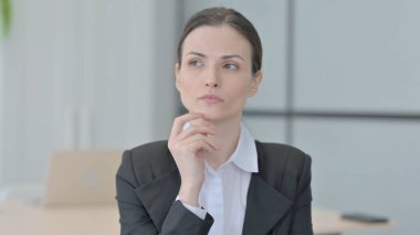 Portrait of Brainstorming Businesswoman Thinking New Plan