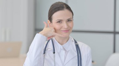 Gesture of Call Me for Consultation and Help by Young Doctor clipart