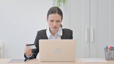 Young Businesswoman Unable to make Online Payment on Laptop