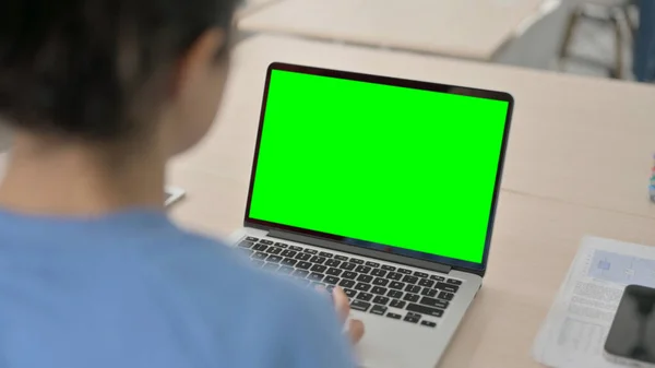 Indian Woman Working on Laptop with Green Chroma Screen