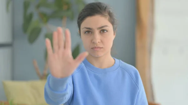 Portrait of Indian Woman in Denial with Stop Gesture