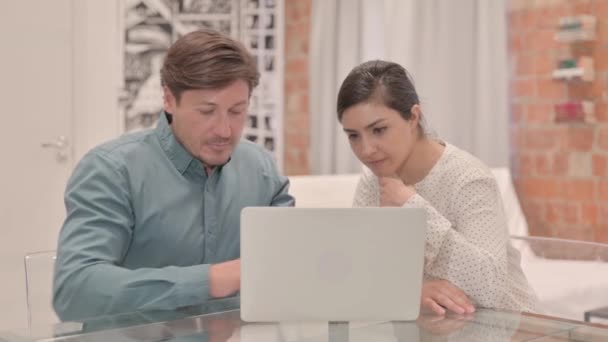 Excited Interracial Couple Celebrating Success Laptop — Stock Video