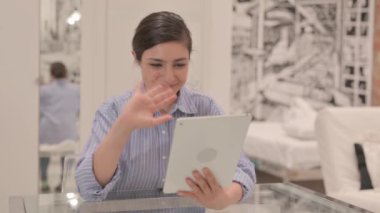 Young Woman Doing Video Chat on Tablet