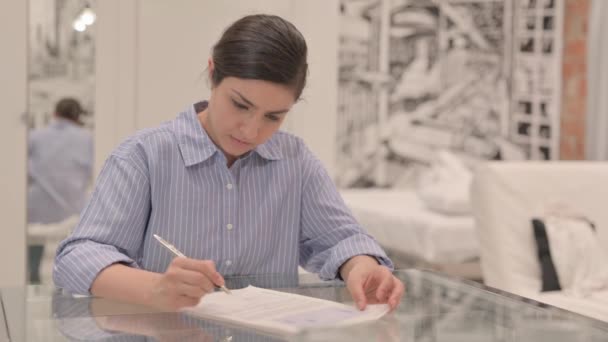 Young Woman Doing Paperwork Checking Douments — Stock Video