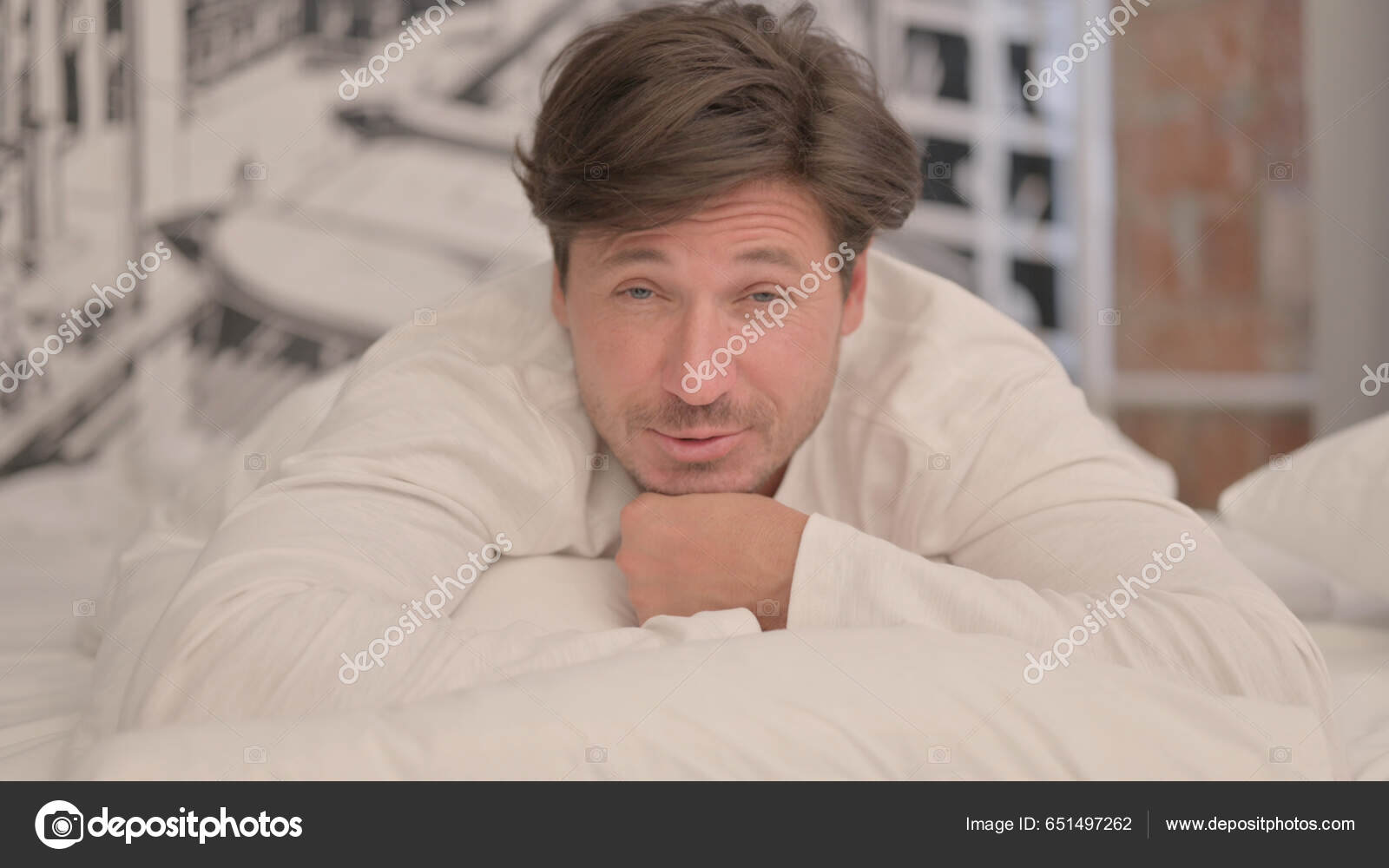 Talking Mature Adult Man Doing Video Chat While Lying Stomach — Stock Photo  © Zmaster #651497262