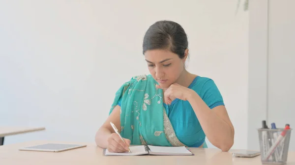 Indian Woman in Sari Writing Letter at Work