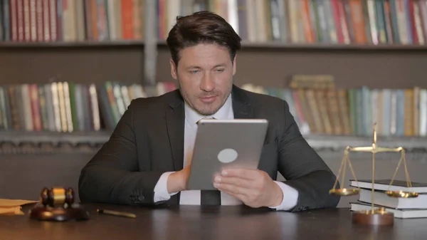 Male Lawyer using Tablet in Office