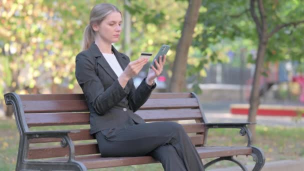 Businesswoman Shopping Online While Sitting Outdoor — Stock Video