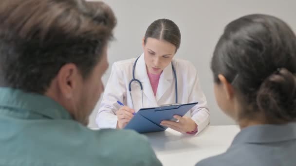 Female Doctor Sharing Good News Anxious Couple — Stock Video