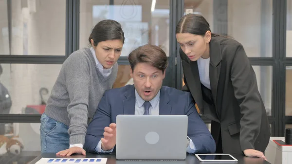 Mixed Race Teammates Reacting to Loss in Office