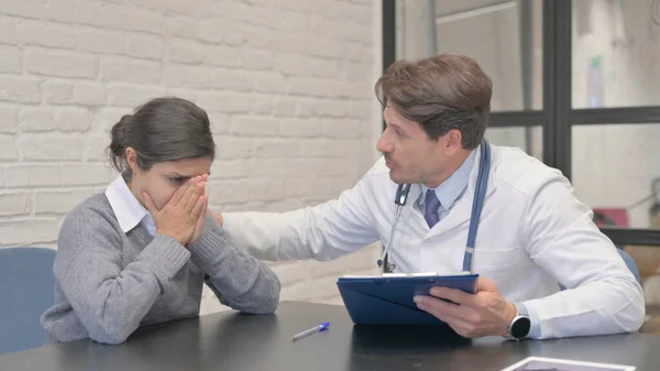 Doctor Helping Crying Indian Woman, Sharing Medical Reports