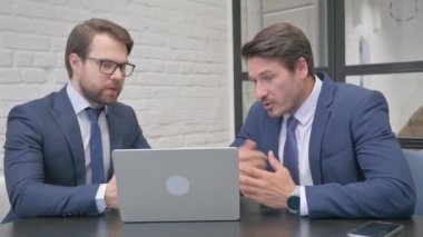Angry Businessmen in Argument at Work