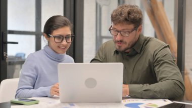 Creative People Working on Laptop in Office